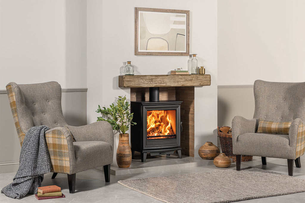 Chesterfield 5 Wide Multi-fuel Stove in a fireplace suite in a living room