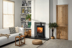 Chesterfield 5 Wide Multi-fuel Stove on Black Hearth and in White Wall Fireplace