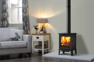 Chesterfield 5 Multi-fuel Ecodesign Stove with optional long legs on a gray hearth