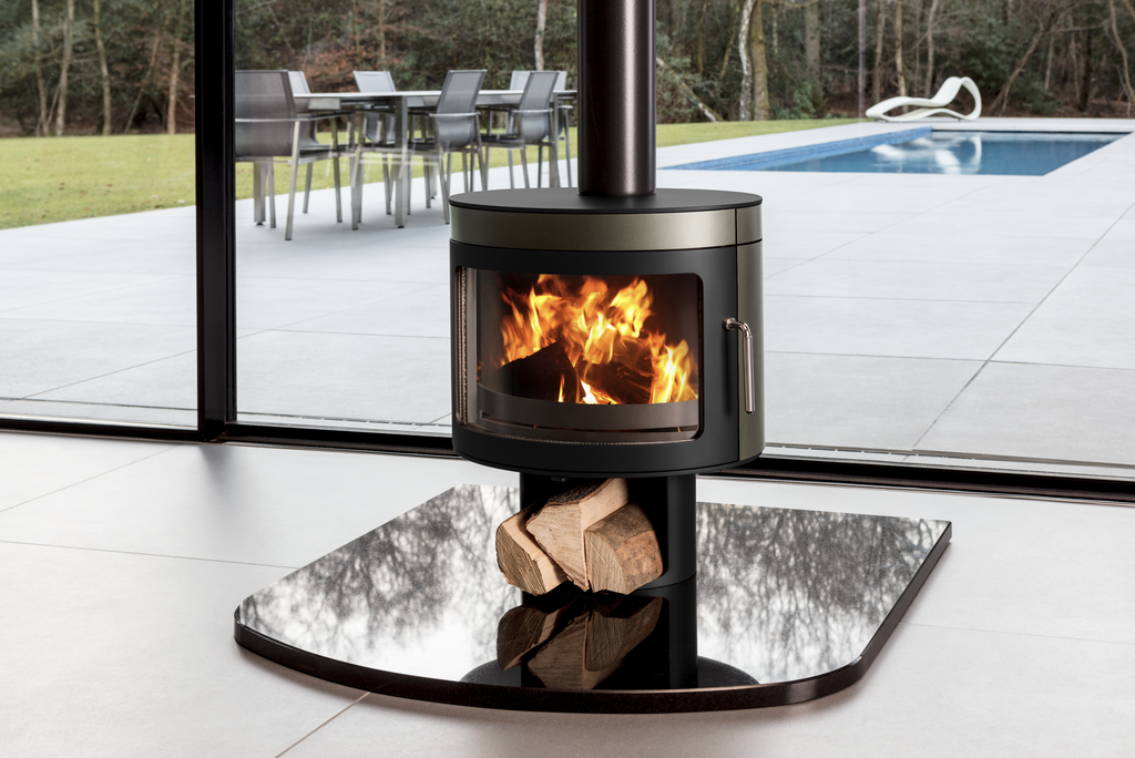 Future Fires - Panoramic FX2 - 5KW Wood Burning Stove with flames and log storage on top of a black hearth in a modern living room