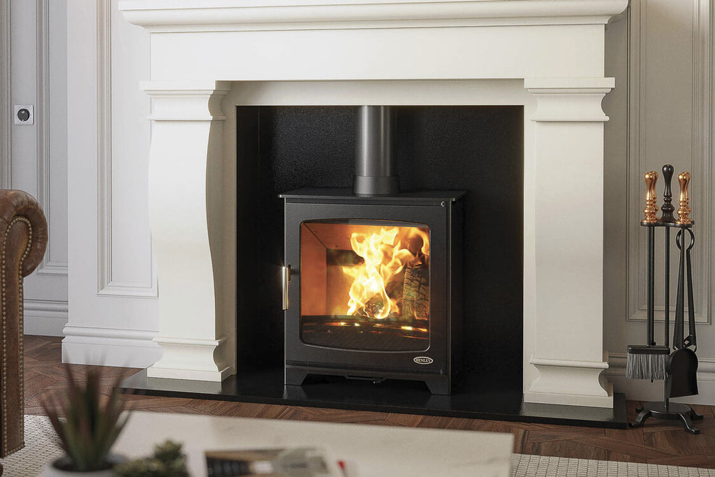 Henley Hazelwood 5 Landscape Wood Burning Stove in a white fireplace suite