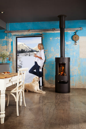 Opus - Trio Scala Gas Stove - 5kW cylindrical stove in dining room in the winter