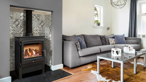 Portway - P2 Contemporary - 4.2kW Gas Stove in a fireplace suite in a living room