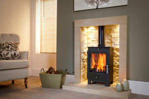 Portway Arundel 5kW Multifuel Stove with flames in a fireplace suite in a living room